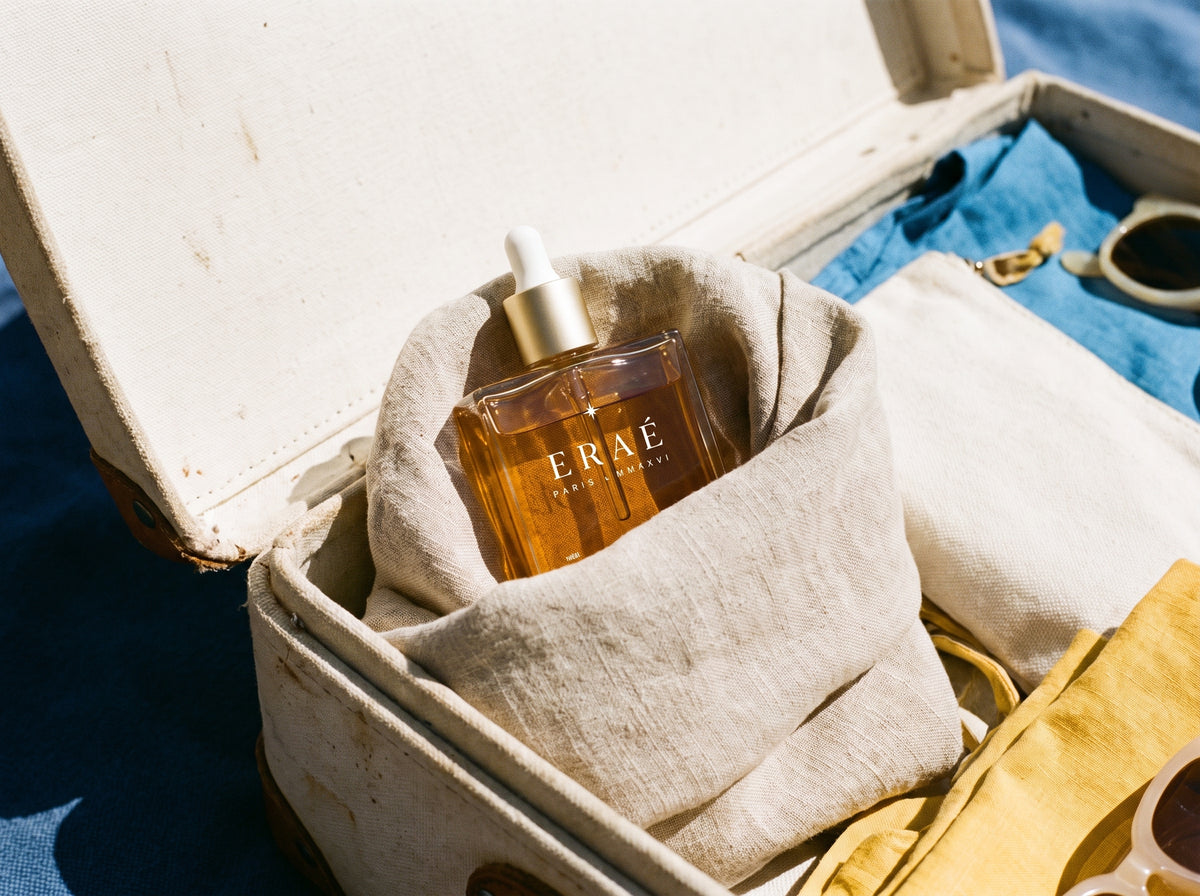 woman about 60 holding the open box with the bottle · 720×880