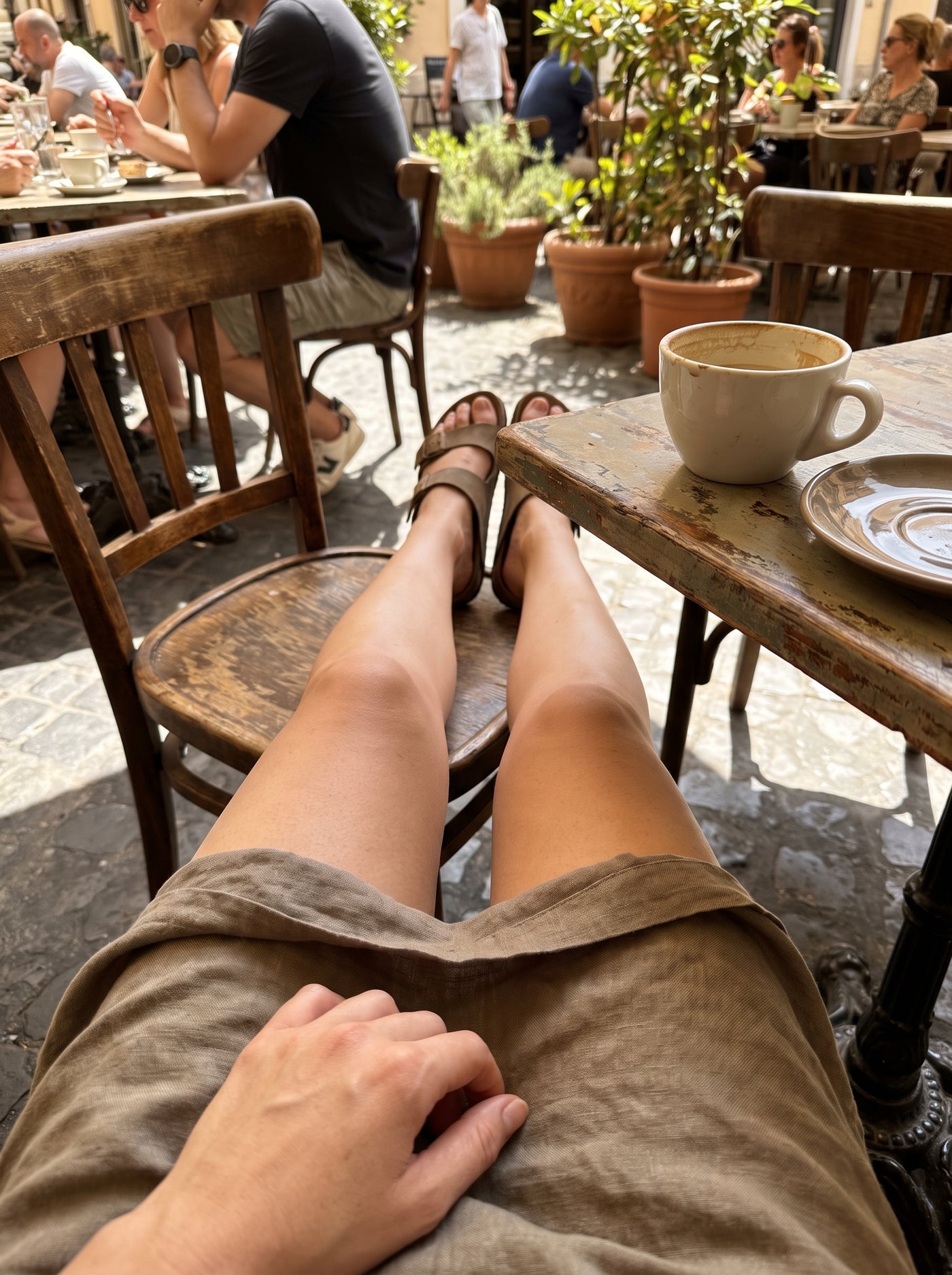 The tell that a client is genuinely back: she stops thinking about her legs at all. She's just a person at a table.