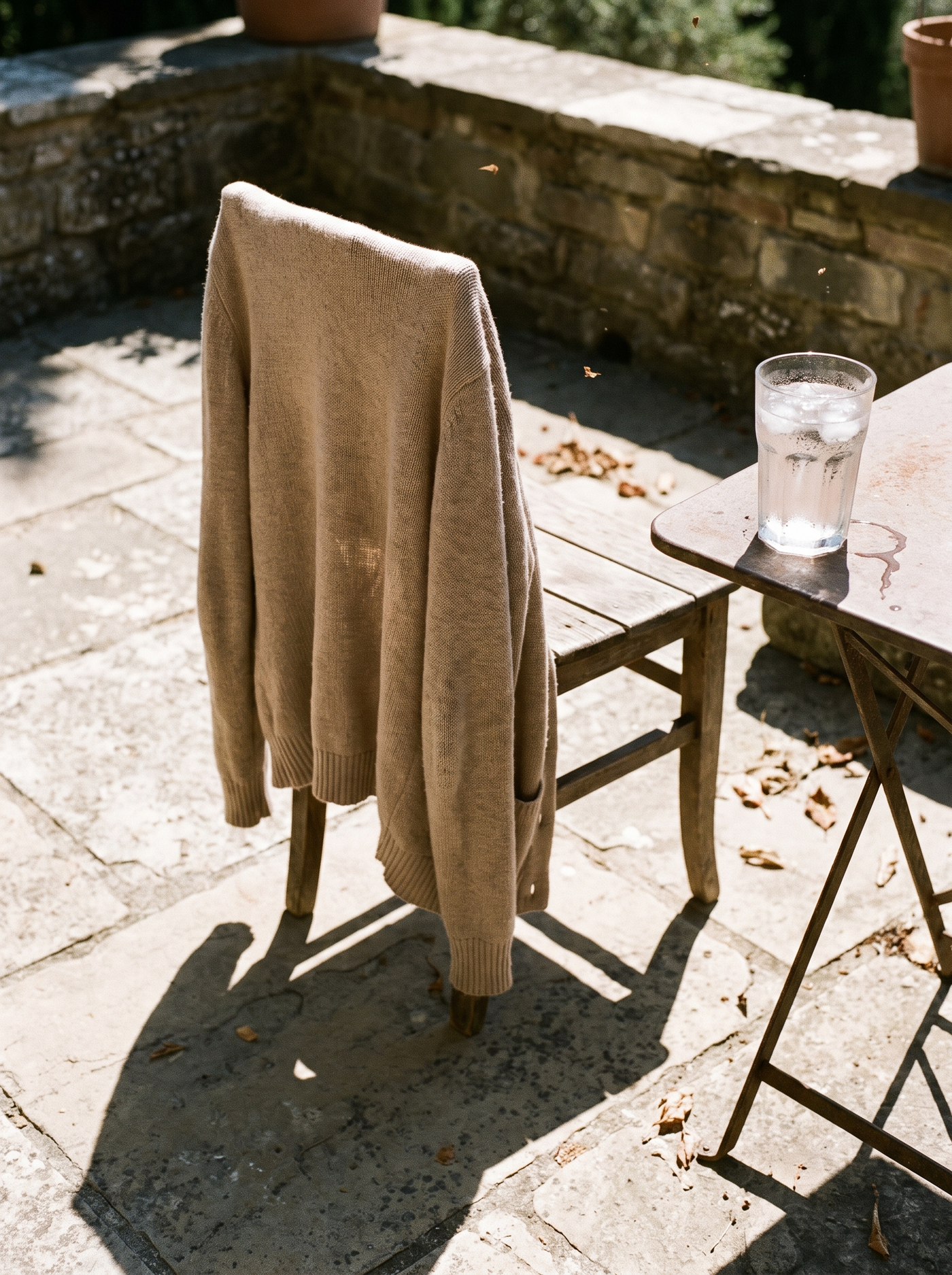 July, 91 degrees. The cardigan stays on. In the threads they call it “running cold” — the lie that comes with its own wardrobe.
