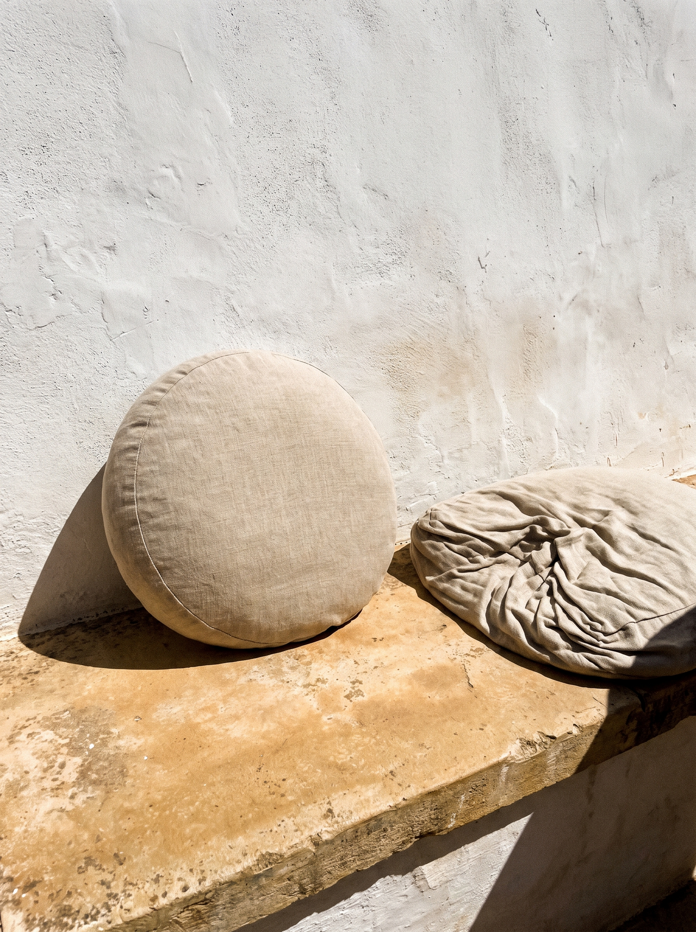 Same fabric, different filling. The surface only crinkles when the cushion beneath it empties — which is why treating the surface never worked.